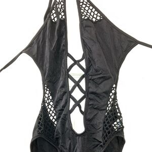 Black body suit with cutouts and mesh detail
